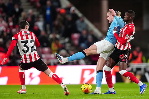 Manchester City's Erling Haaland and Sunderland's Nordi Mukiele, right, in action during the English Premier League soccer match between Sunderland and Manchester City in Sunderland, England.