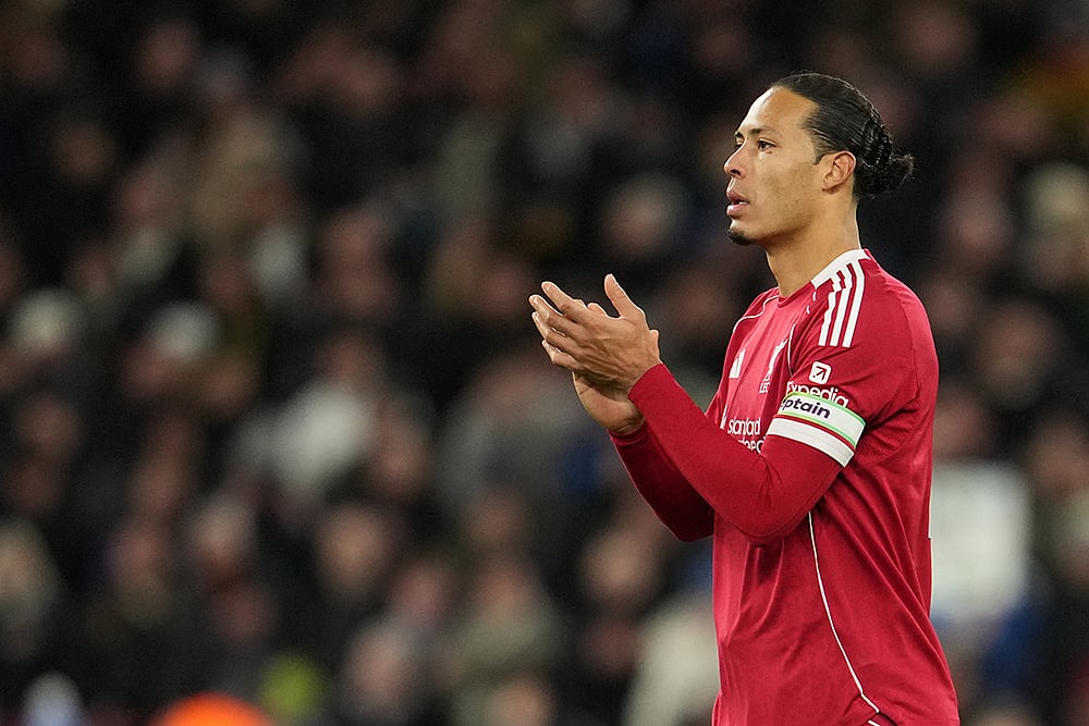 | Photo: AP/Jon Super : Liverpool's Virgil van Dijk applauds to supporters at the end of the English Premier League soccer match between Liverpool and Leeds United in Liverpool, England