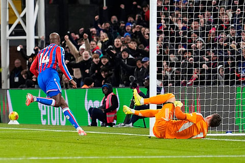 Crystal Palace's Jean-Philippe Mateta, left, celebrates after scoring his sides first goal during their English Premier League soccer match against Crystal Palace in London.