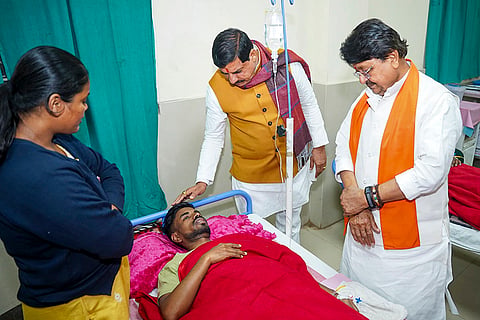 Madhya Pradesh Chief Minister Mohan Yadav and Minister Kailash Vijayvargiya meet an affected person undergoing treatment after consumption of contaminated water, at a hospital in Indore. 