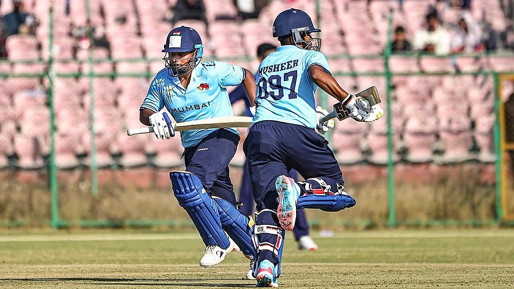 | Photo: PTI : Mumbai's Sarfaraz Khan and Musheer Khan run between the wickets during the Vijay Hazare Trophy 2025-26 cricket match between Mumbai and Uttarakhand, at Sawai Mansingh Stadium, in Jaipur.