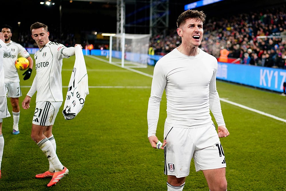 | Photo: Jordan Pettitt/PA via AP : Fulham's Tom Cairney (right) celebrates after scoring his sides first goal during their English Premier League soccer match against Crystal Palace in London.