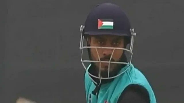 | X | :  Furqan Ul Haq, a cricketer from south Kashmir was seen wearing a helmet bearing the Palestinian flag 