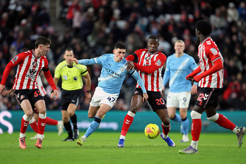 | Photo: Richard Sellers/PA via AP : Manchester City's Phil Foden, center left, and Sunderland's Nordi Mukiele in action during the English Premier League soccer match between Sunderland and Manchester City in Sunderland, England.