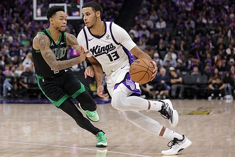 Sacramento Kings forward Keegan Murray (13) drives against Boston Celtics guard Anfernee Simons during the second half of an NBA basketball game in Sacramento, California.