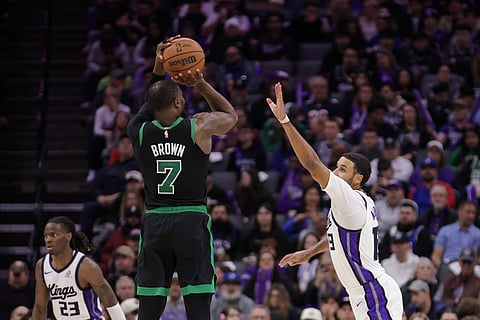 Boston Celtics guard Jaylen Brown (7) shoots a 3-point basket over Sacramento Kings forward Keegan Murray, right, during the second half of an NBA basketball game in Sacramento, California.