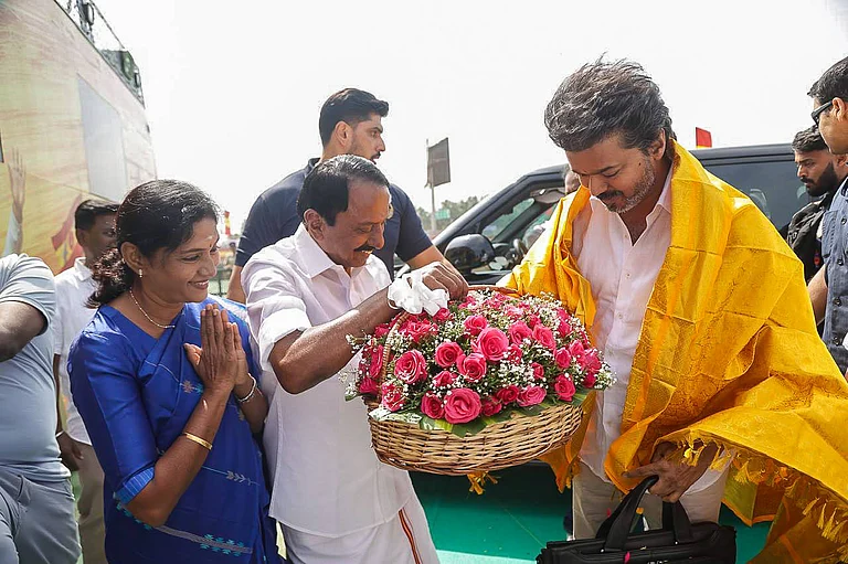 Supporters gather in Erode as TVK founder and actor Vijay addresses a massive public meeting in Erode, Tamil Nadu. - xSeshadrixSukumarx