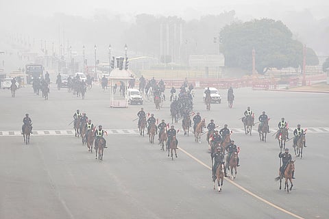 The President's Bodyguards march past during rehearsals ahead of the ‘Republic Day Parade’ on a foggy winter morning, at the Vijay Chowk, in New Delhi.