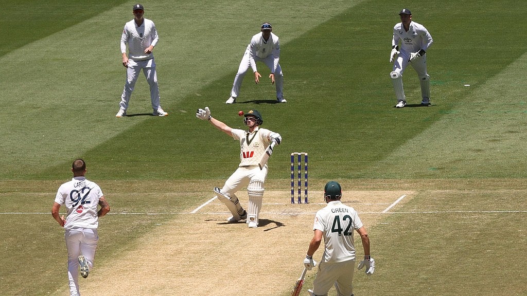 AP : Australia's Steve Smith, centre, closely watches a delivery from England's Brydon Carse, left, on Day 2 of their Ashes Test match in Melbourne.