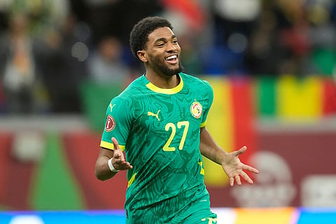 Senegal's Ibrahim Mbaye celebrates after scoring during the Africa Cup of Nations best of 16 soccer match between Senegal and Sudan in Tangier, Morocco.