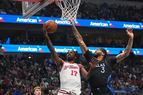 Houston Rockets forward Tari Eason (17) goes up for a basket against Dallas Mavericks forward Anthony Davis (3) during the first half of an NBA basketball game  in Dallas.