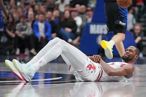 Houston Rockets forward Kevin Durant reacts after falling on a play against the Dallas Mavericks during the second half of an NBA basketball game in Dallas.
