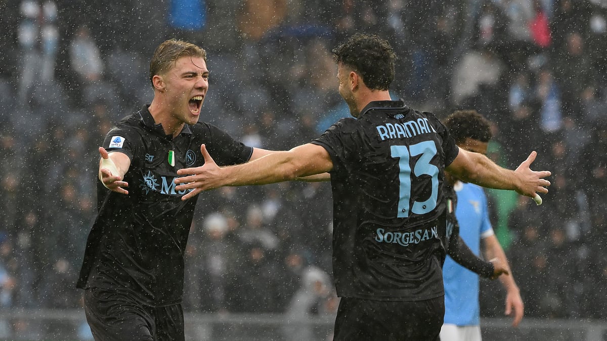 (Fabrizio Corradetti/LaPresse via AP) : Napoli's Amir Rrahmani, right, celebrates with teammate Rasmus Hojlund after scoring during the Italian Serie A soccer match between SS Lazio and SSC Napoli in Rome, Sunday, Jan. 4, 2026.