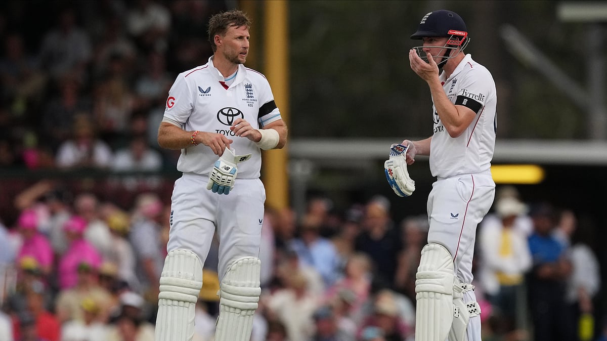 | Photo: AP/Mark Baker : England's Joe Root, left, and teammate Harry Brook talk during play on day one of the fifth and final Ashes cricket test between England and Australia in Sydney, Sunday, Jan. 4, 2026.