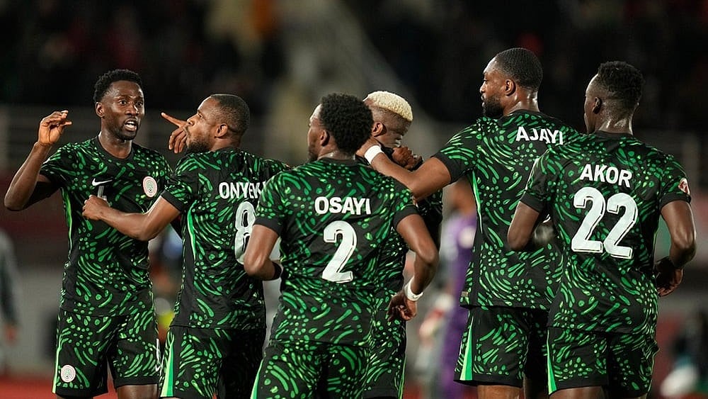 Photo: AP/Mosa'ab Elshamy : Nigeria's players celebrate a goal scored by their teammate Victor Osimhen during the Africa Cup of Nations group C soccer match between Nigeria and Tunisia in Fez, Morocco.