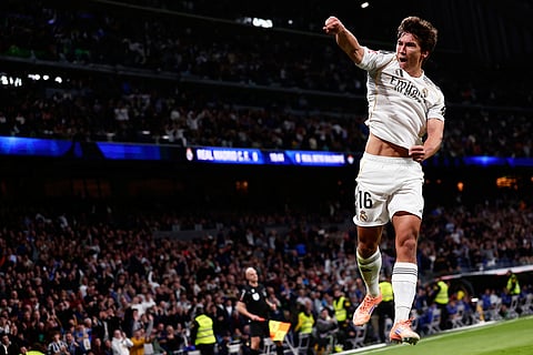 Real Madrid's Gonzalo Garcia celebrates after scoring his sides first goal during the Spanish La Liga soccer match between Real Madrid and Real Betis Sevilla in Madrid, Spain.