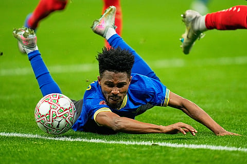 Tanzania's Iddy Nado falls while chasing the ball during the Africa Cup of Nations round of 16 soccer match between Morocco and Tanzania in Rabat, Morocco.