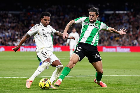 Betis' Ricardo Rodriguez, right, challenges Real Madrid's Rodrygo during the Spanish La Liga soccer match between Real Madrid and Real Betis Sevilla in Madrid, Spain.