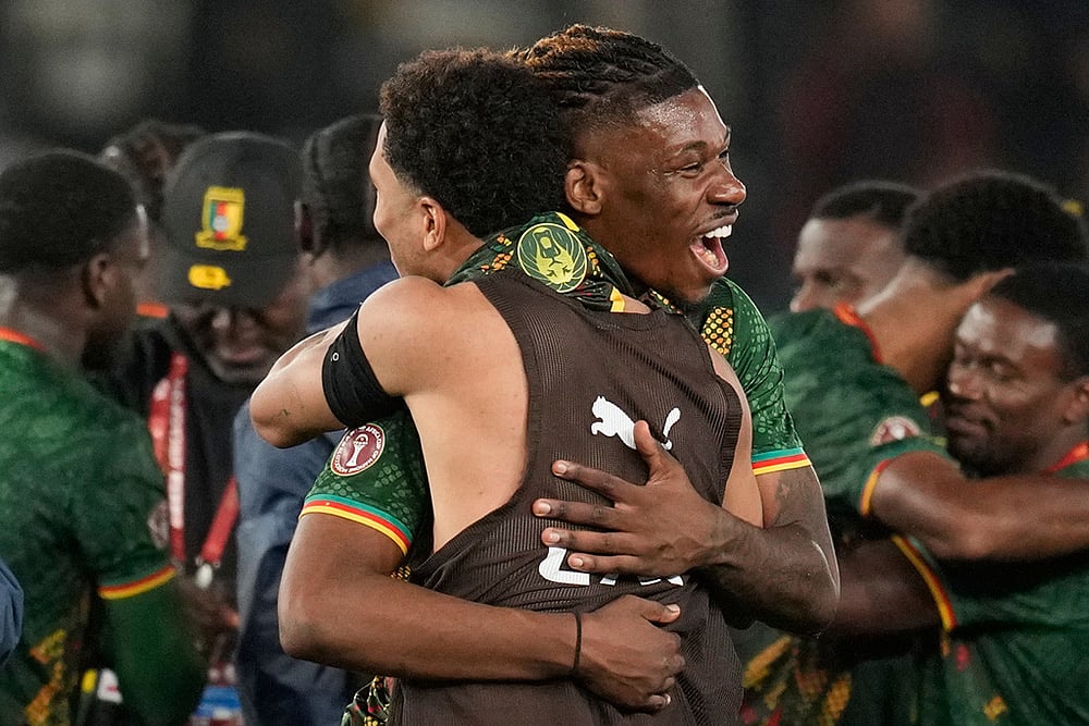| Photo: AP/Themba Hadebe : Cameroon's players celebrate after losing the Africa Cup of Nations round of 16 soccer match between South Africa and Cameroon in Rabat, Morocco.