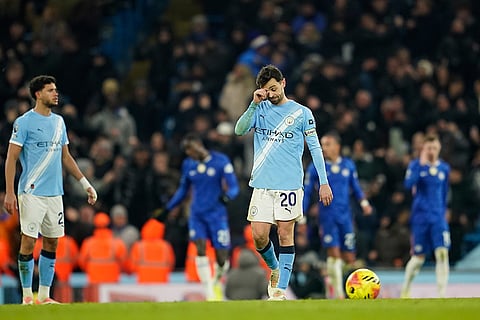 Manchester City's Bernardo Silva reacts after Chelsea's Enzo Fernandez scoring during the English Premier League soccer match between Manchester City and Chelsea in Manchester, England.