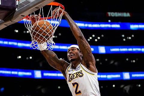 Los Angeles Lakers forward Jarred Vanderbilt (2) dunks the ball during the second half of an NBA basketball game against the Memphis Grizzlies, in Los Angeles.