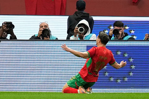 Morocco's Brahim Abdelkader Diaz celebrates after scoring the opening goal during the Africa Cup of Nations round of 16 soccer match between Morocco and Tanzania in Rabat, Morocco.