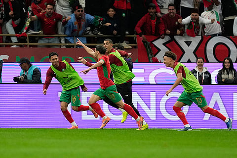 Morocco's Brahim Abdelkader Diaz, second left, celebrates after scoring the opening goal during the Africa Cup of Nations round of 16 soccer match between Morocco and Tanzania in Rabat, Morocco.