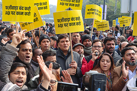 AAP leader Saurabh Bharadwaj, centre, with party leaders during a protest over the issue of air pollution in the national capital, in New Delhi.