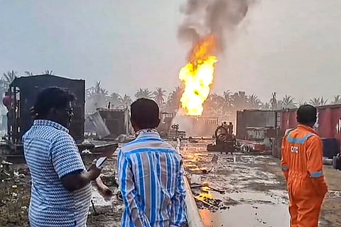 Smoke and flames billow out after a gas leak at an ONGC sparked an inferno, leading to the evacuation of around 600 people from three villages within a four-km radius, in Konaseema, Andhra Pradesh.