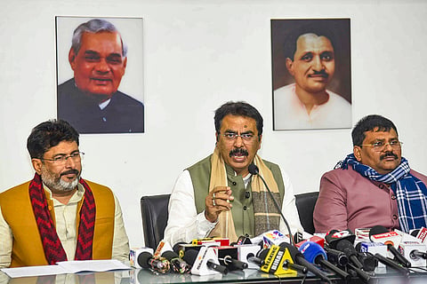 Bihar BJP President Sanjay Saraogi, centre, addresses a press conference, in Patna. State Janata Dal (United) President Umesh Singh Kushwaha, right, and state Lok Janshakti Party (Ramvilas) President Raju Tiwari also seen. 
