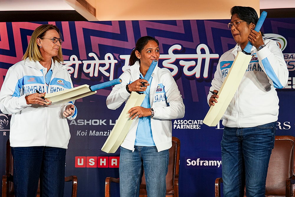 | Photo: PTI/Kunal Patil : From left, Mumbai Indians’ head coach Lisa Keightley, captain Harmanpreet Kaur and mentor Jhulan Goswami during the Women's Super League’s (WPL) pre-season press conference, in Mumbai.