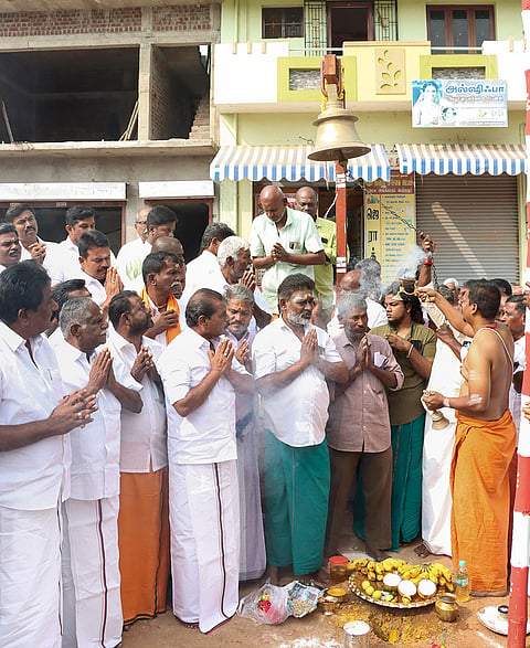 Tamil Nadu Commercial Taxes and Registration Minister P Moorthy, left, and others offer prayers during the ‘bhoomi pooja’ function for ‘Jallikattu’, in Madurai district, Tamil Nadu.