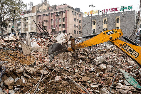An anti-encroachment drive underway on land adjoining the Syed Faiz Elahi Mosque and a nearby graveyard, in New Delhi. 