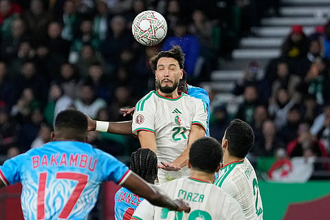 Algeria's Adil Boulbina heads the ball during the Africa Cup of Nations round of 16 soccer match between Algeria and DR Congo in Rabat, Morocco.