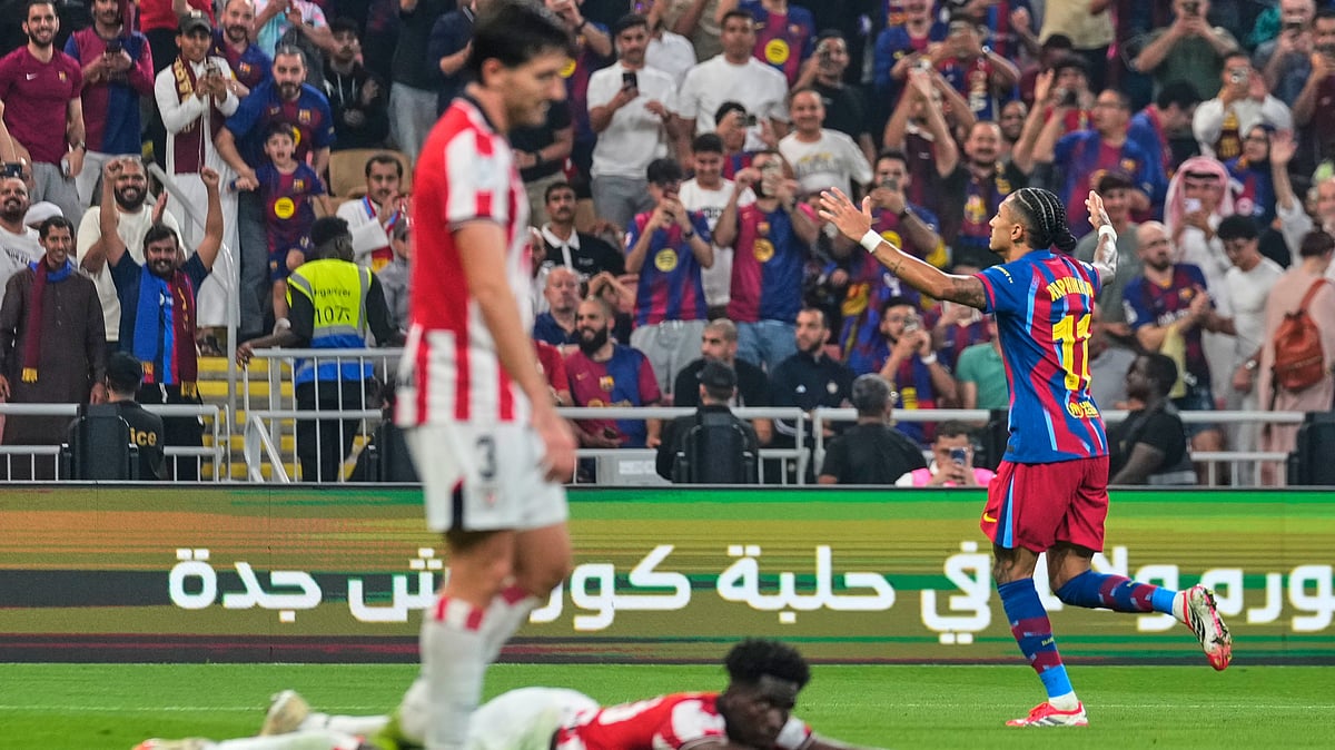 (AP Photo/Altaf Qadri) : Barcelona's Raphinha celebrates after scoring the fifth goal during the Spanish Super Cup semifinal soccer match against Athletic Club Bilbao at King Abdullah Sports City Stadium in Jeddah, Saudi Arabia, Wednesday, Jan. 7, 2026.