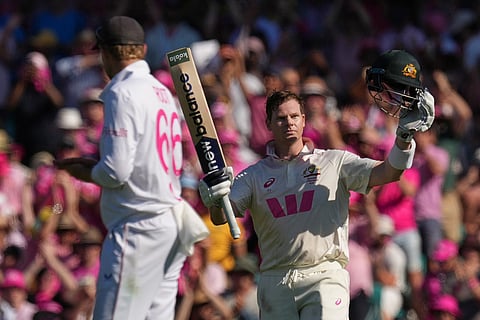 Australia's Steve Smith celebrates after scoring a century during play on day three of the fifth and final Ashes cricket test between England and Australia in Sydney.