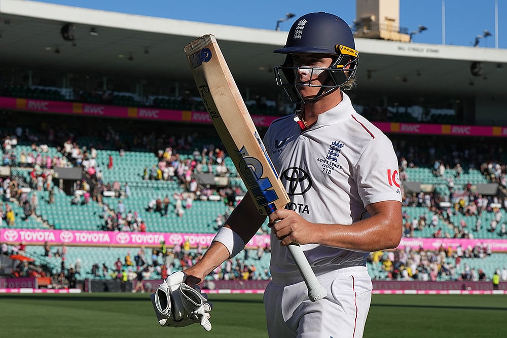 | Photo: AP/Mark Baker : England's Jacob Bethell walks from the field at the close of play during on day four of the fifth and final Ashes cricket test between England and Australia in Sydney.
