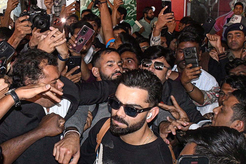 | Photo: PTI : Cricketer Virat Kohli upon his arrival at Vadodara Airport ahead of India's ODI cricket series with New Zealand, Gujarat.