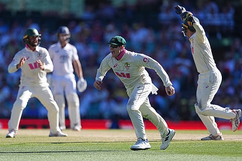 Australia's Steve Smith reacts after taking a catch to dismiss England's Ben Stokes during play on day four of the fifth and final Ashes cricket test between England and Australia in Sydney.