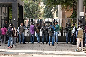Photo: PTI/Swapan Mahapatra : Media personnel outside the residence of Pratik Jain, director of political consultancy firm I-PAC, in Kolkata. The Enforcement Directorate on Thursday conducted searches on the premises of political consultancy firm I-PAC and its director Pratik Jain in Kolkata as part of a money laundering investigation, official sources said.