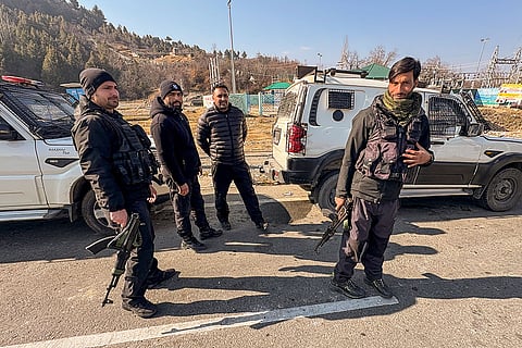Security personnel keep vigil amid high alert ahead of Republic Day celebrations, near Navyug tunnel, on Jammu-Srinagar National Highway