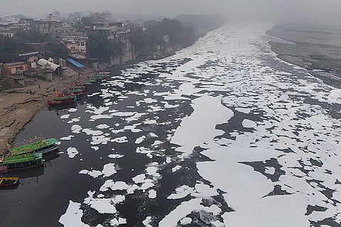 Toxic foam floats on the surface of the Yamuna river, near Mathura.