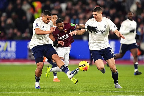 West Ham United's Crysencio Summerville in action against Nottingham Forest's Murillo, left, and Nikola Milenkovic  during the English Premier League soccer match between West Ham United and Nottingham Forest in London.