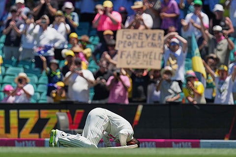 Australia Usman Khawaja kisses the turf as he leaves the field during play on the last day of the fifth and final Ashes cricket test between England and Australia in Sydney.