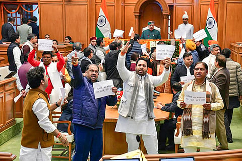 In this handout image received on Jan. 8, 2026, BJP MLAs protest against Leader of Opposition in the Delhi Assembly and AAP leader Atishi, demanding the cancellation of her House membership for allegedly 'disrespecting' Sikh Guru Tegh Bahadur, during the Winter session of the Assembly, in New Delhi.
