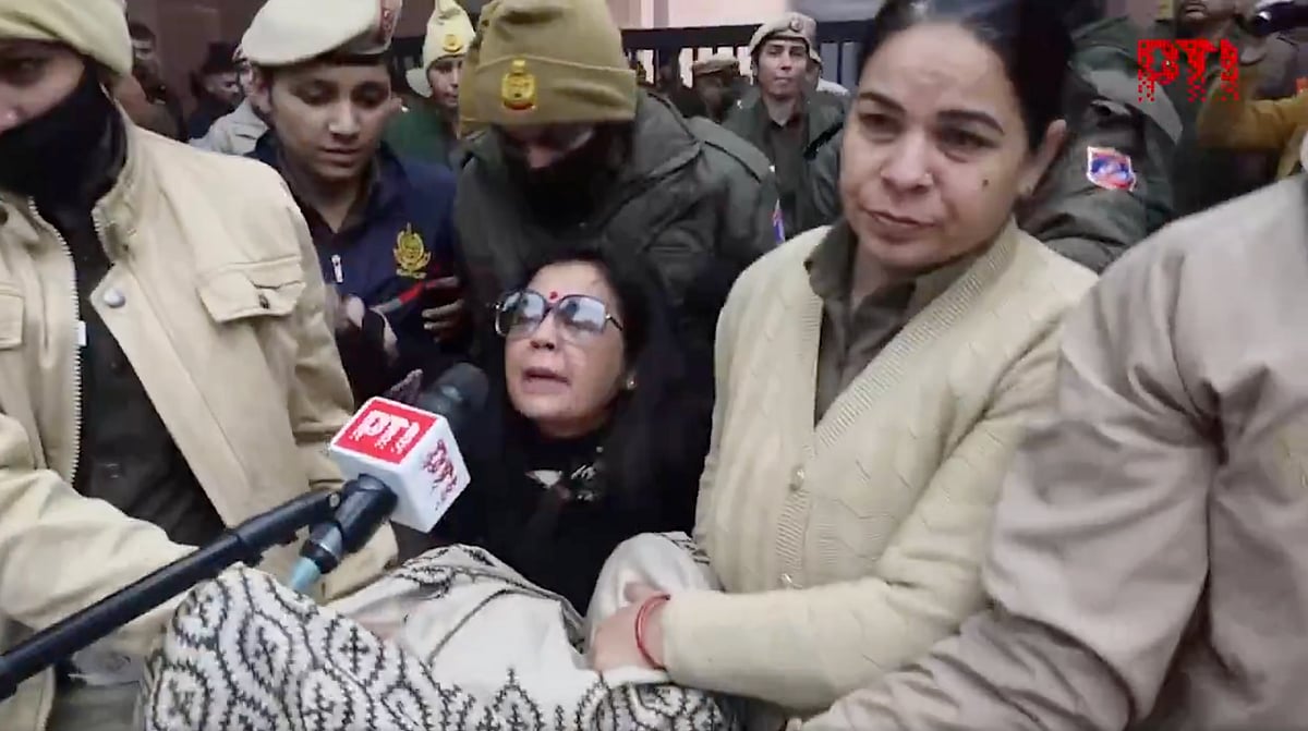 Video screengrab of police detaining TMC MP Mahua Moitra as party MPs protest outside Union Home Minister Amit Shah's office against ED raids on the I-PAC office in Kolkata
 - Source: X / PTI