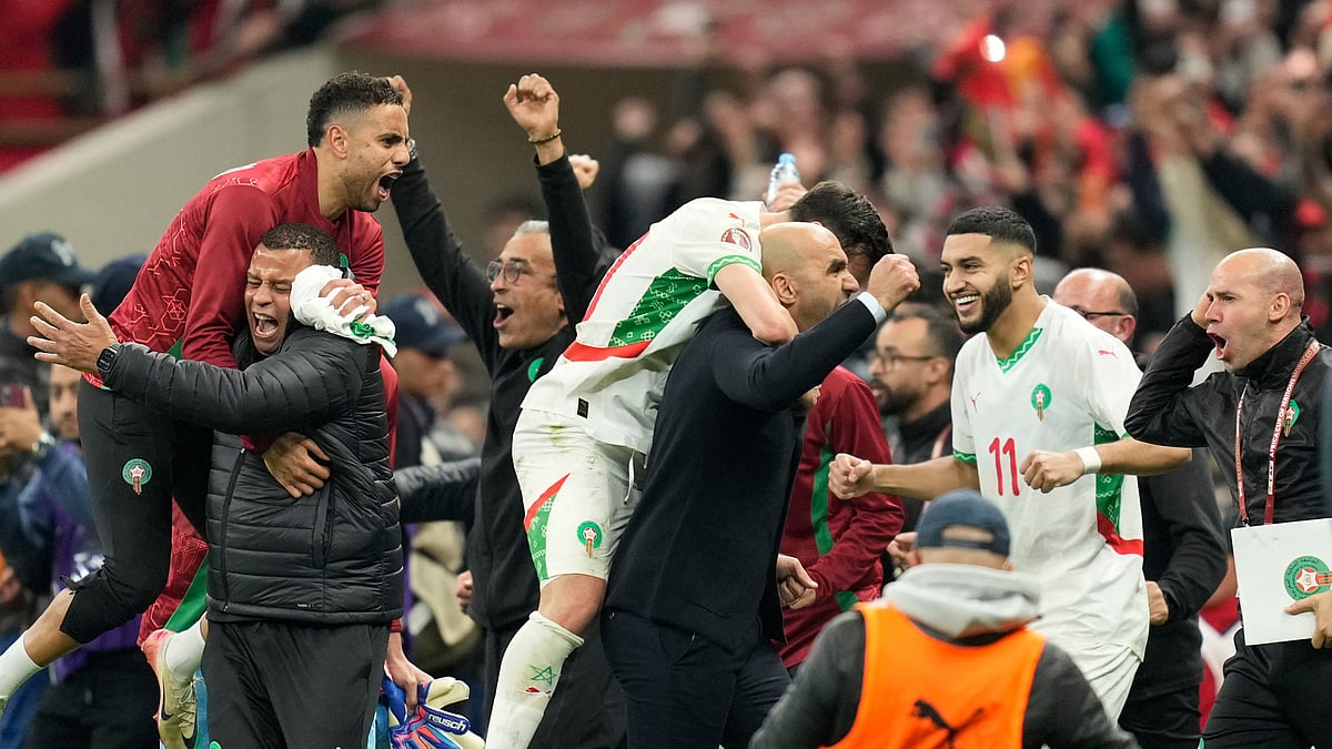 (AP Photo/Mosa'ab Elshamy) : Morocco players celebrate after the Africa Cup of Nations quarterfinal soccer match between Cameroon and Morocco, in Rabat, Morocco, Friday, Jan. 9, 2026.