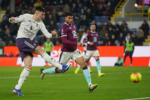 Manchester United's Benjamin Sesko scores during the Premier League soccer match between Burnley and Manchester United in Burnley, England.