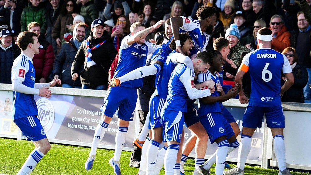 Martin Rickett/PA via AP : Macclesfield Town's Isaac Buckley-Ricketts celebrates scoring his side's second goal with teammates, during the FA Cup third-round match between Macclesfield Town and Crystal Palace.