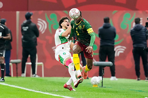 Cameroon's Nouhou Tolo, right, is challenged by Morocco's Abdessamad Ezzalzouli during the Africa Cup of Nations quarterfinal soccer match between Cameroon and Morocco, in Rabat, Morocco.